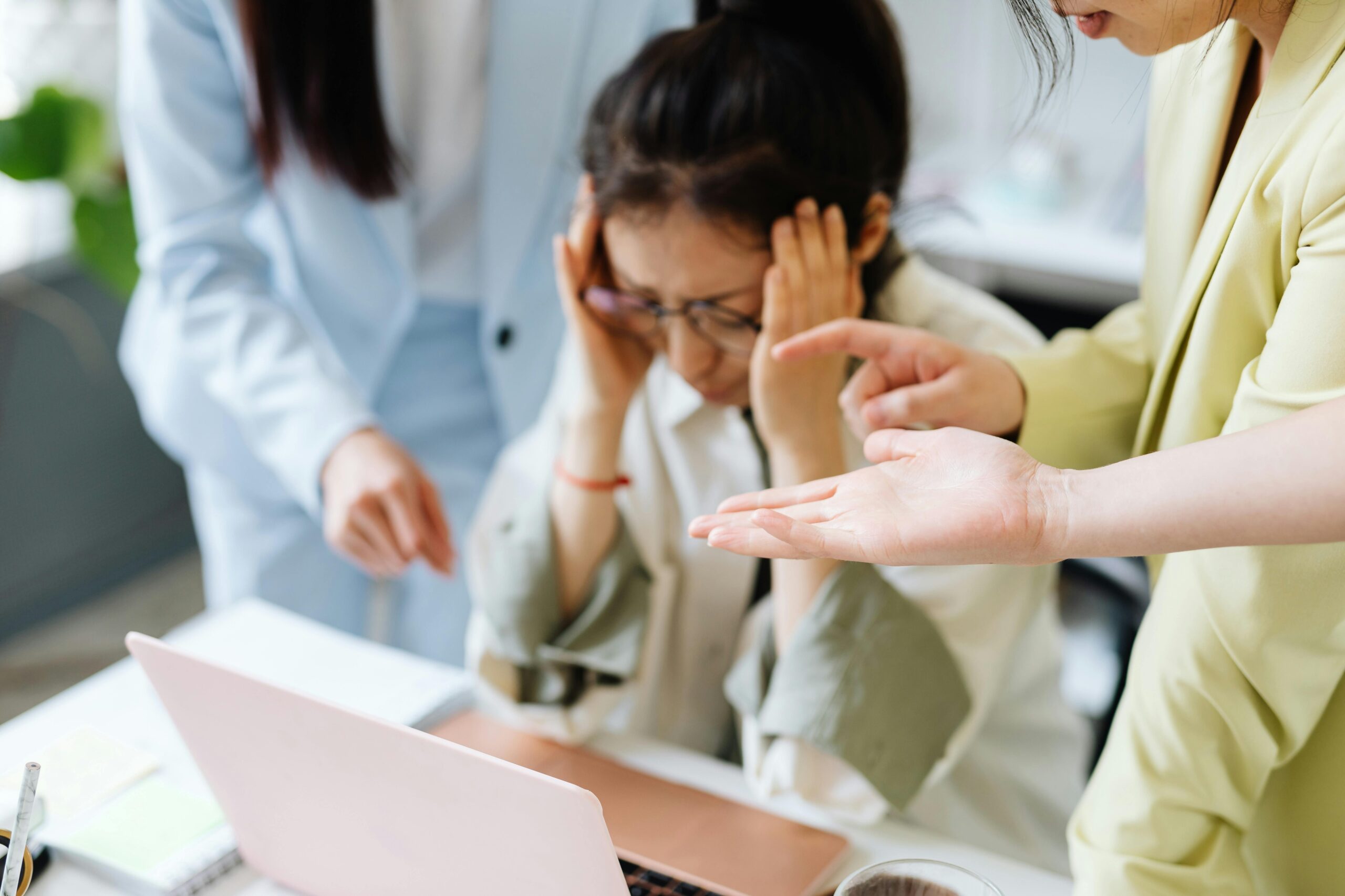 Woman stressed out holding head